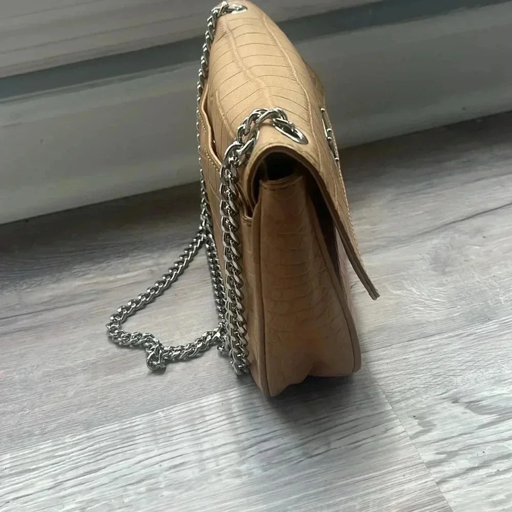 Tan Michael Kors envelope chain crossbody purse with adjustable straps